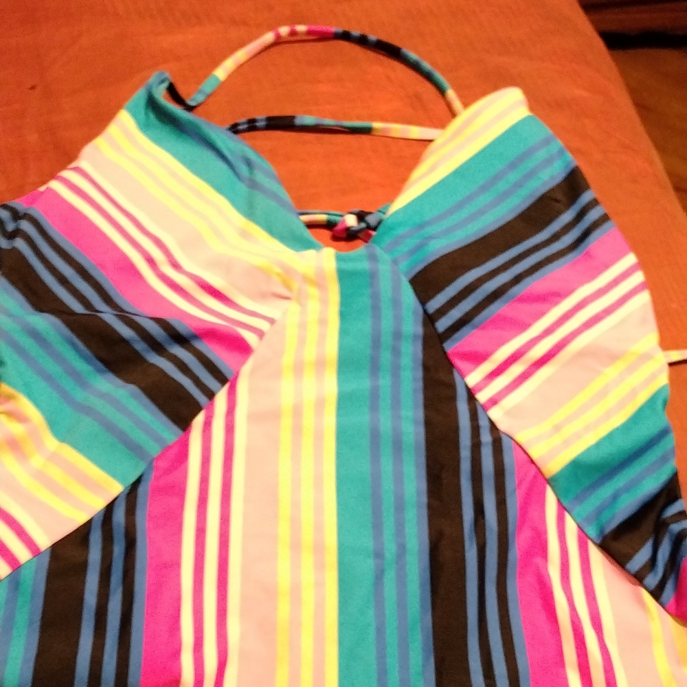 Lady swimming suit teal the background color light to dark pink stripes ,blue,bl